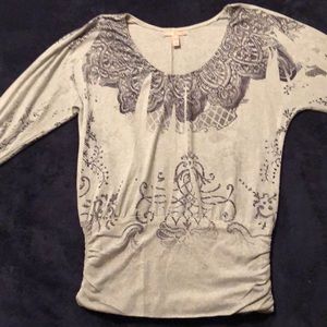 Stylish American Rag top. Gray w/black design.